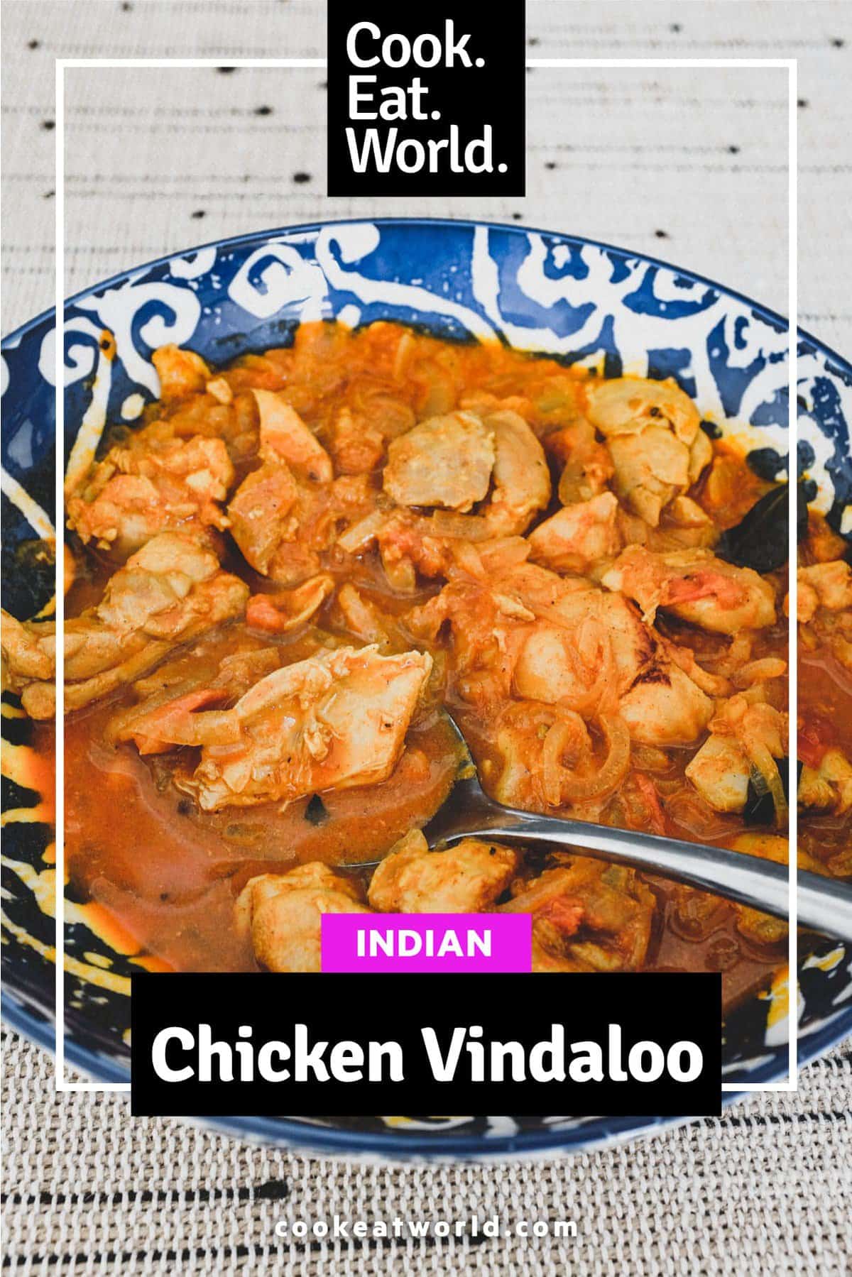 Chicken cooked with vinegar. spices, garlic and tomato.