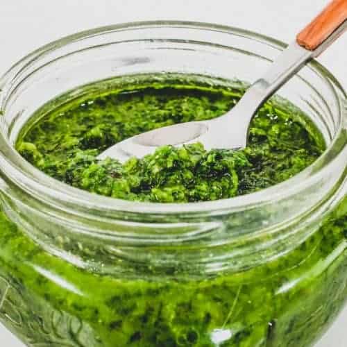 A small mason jar holds a green salsa from Georgia called Ajika