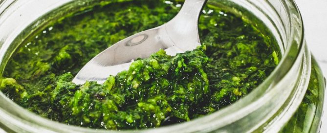 A small mason jar holds a green salsa from Georgia called Ajika