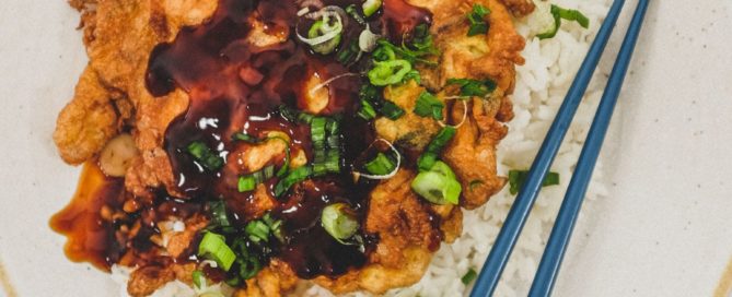 Chicken egg foo young with savoury oyster sauce gravy and white rice