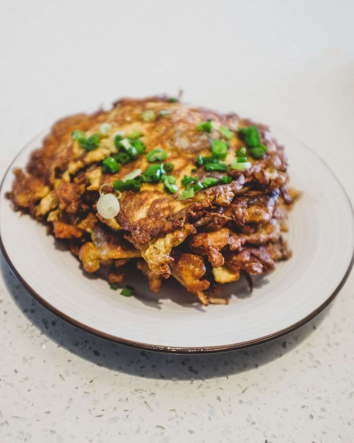 A stack of chicken egg foo young patties