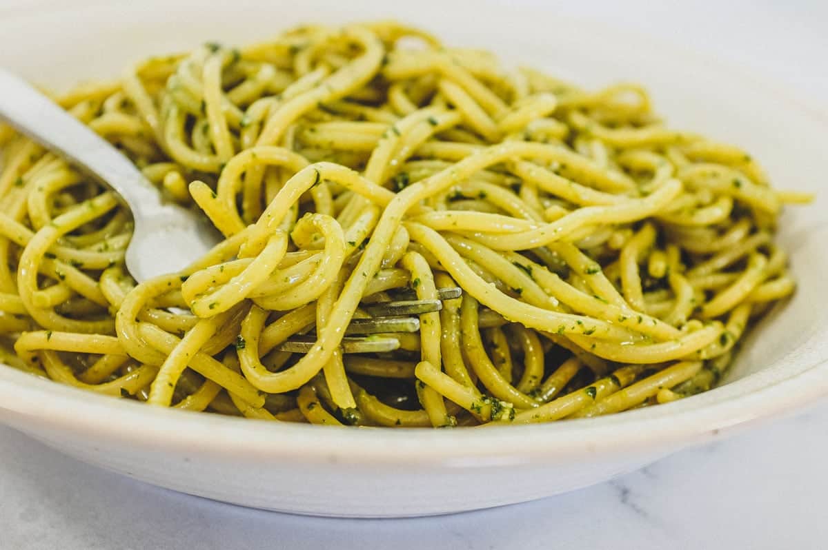 A bowl of spaghetti mixed with Pesto Genovese