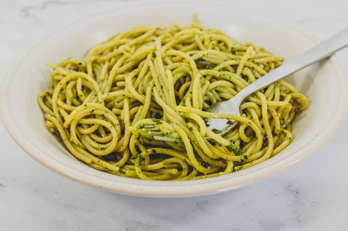A bowl of spaghetti mixed with Pesto Genovese