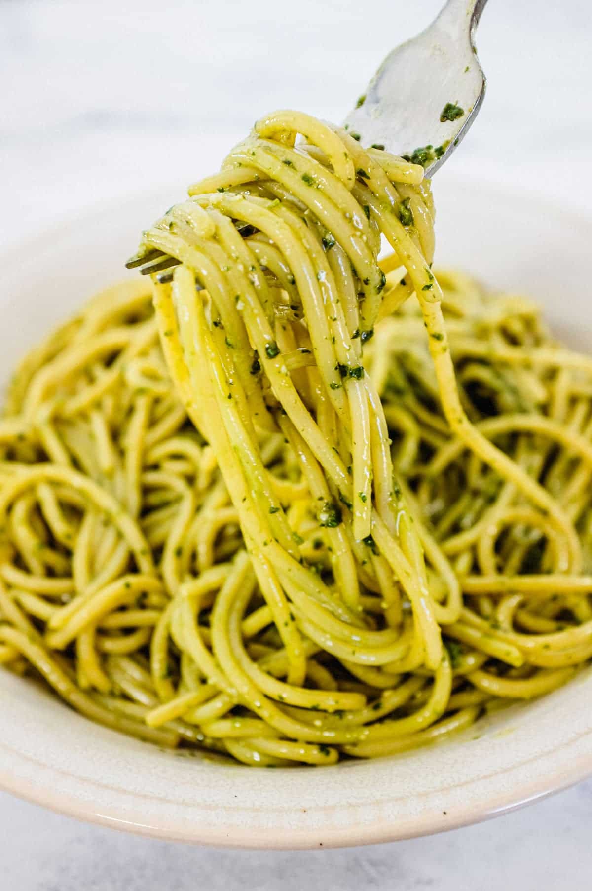 A bowl of spaghetti mixed with Pesto Genovese