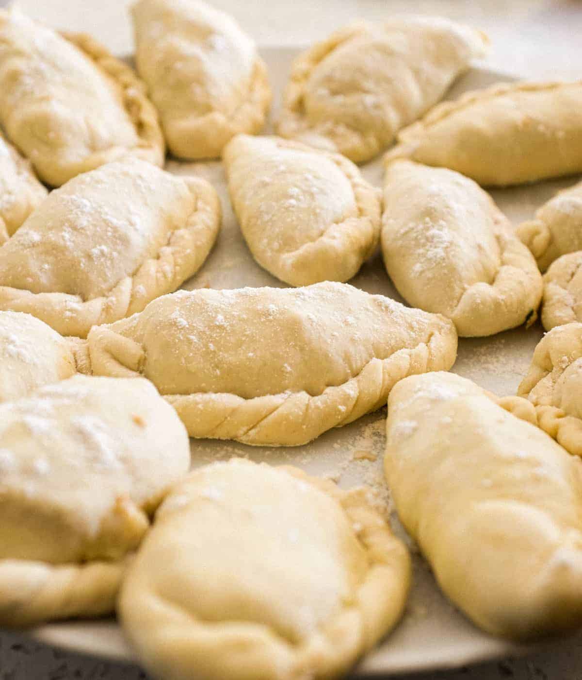 Panzerotti folded and ready to cook on a plate