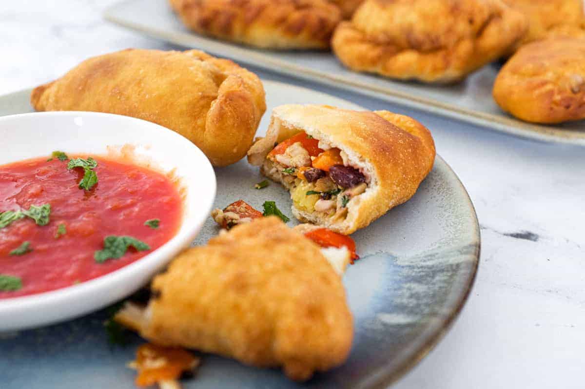 Folding the Panzerotti dough using a rolling seal technique like a pasty.