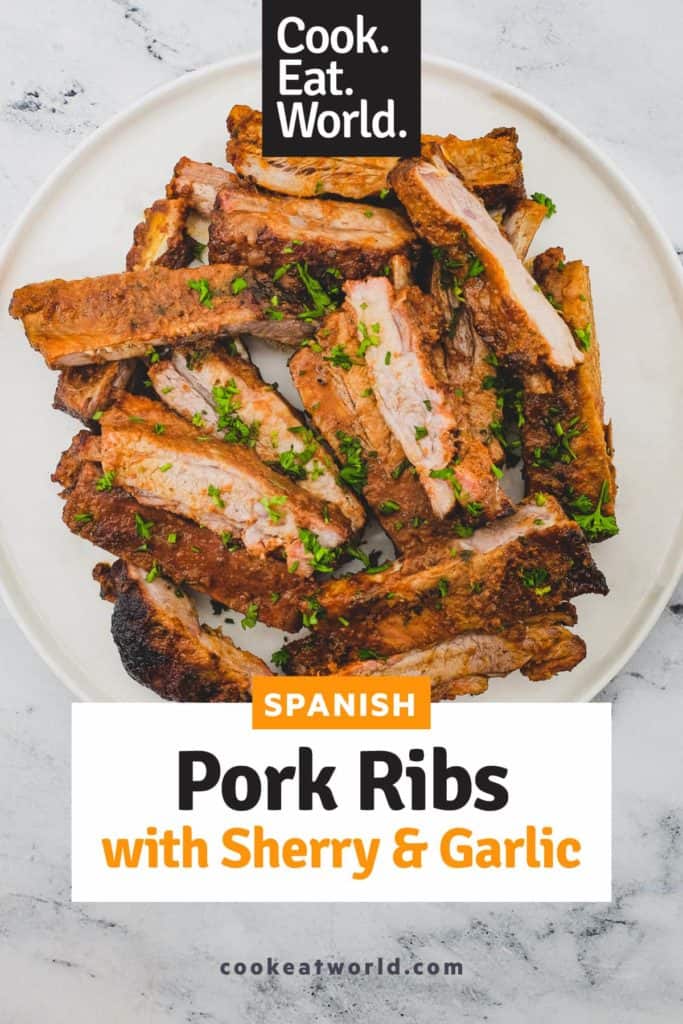 Pork ribs sit on a large platter.