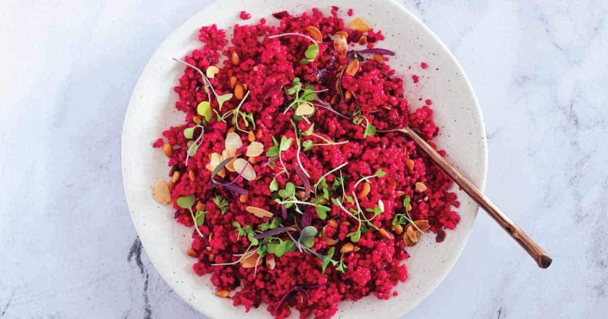 A bowl of Israeli Cous Cous with beetroot