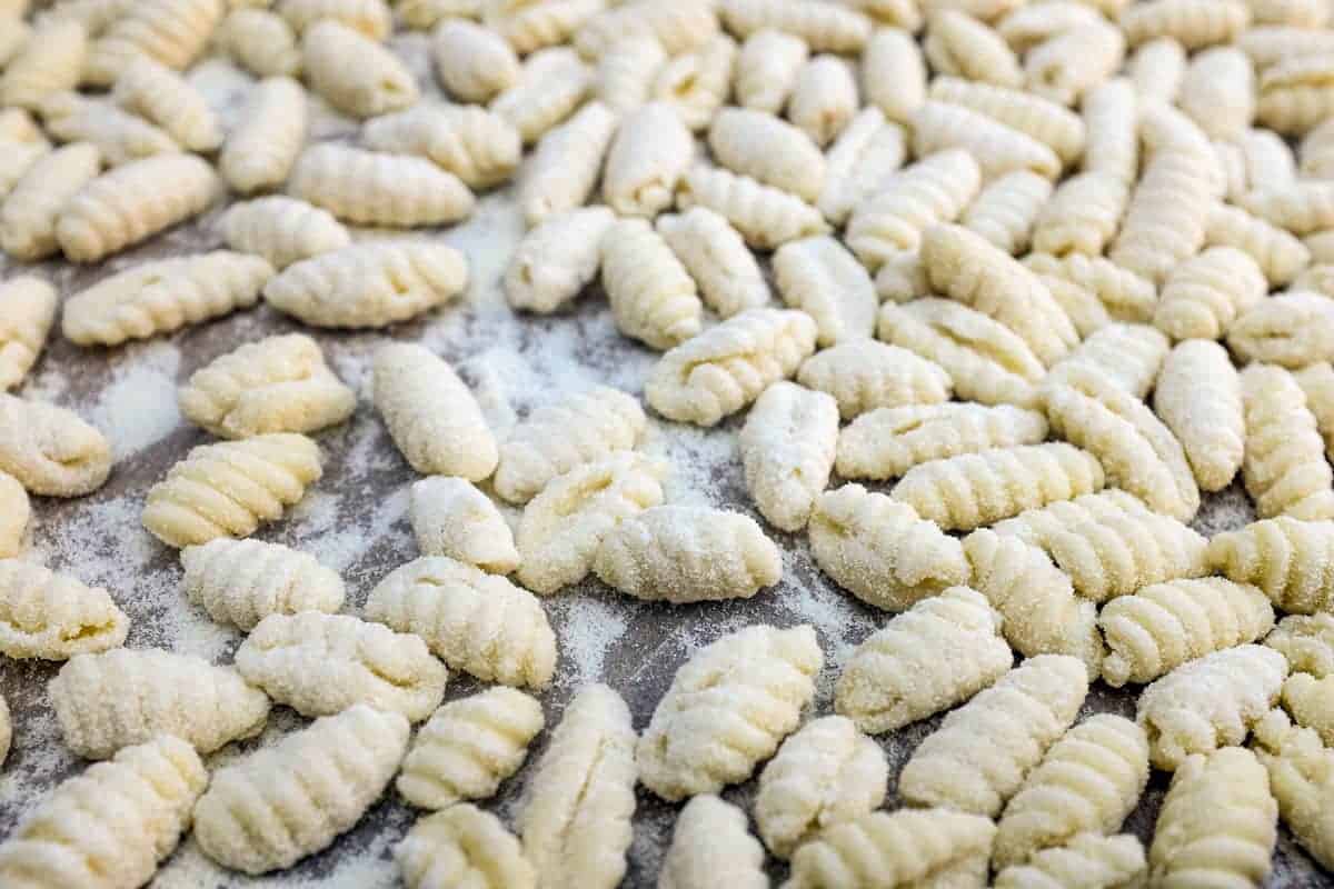 Pasta dough made into Malloreddus (Gnocchetti Sardi) shapes.