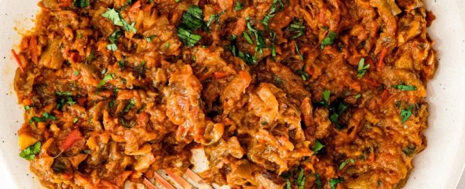 Zaalouk, a Moroccan dip or salad on a platter with a fork