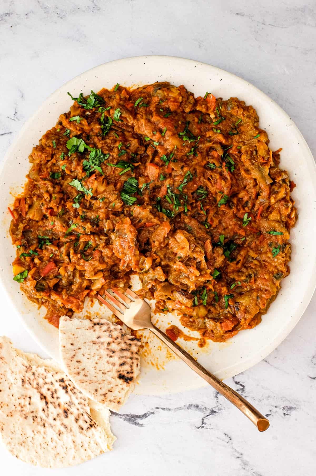 Zaalouk, a Moroccan dip or salad on a platter with a fork