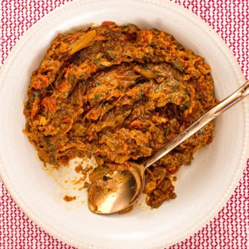 Zaalouk, a Moroccan dip or salad on a platter with a spoon