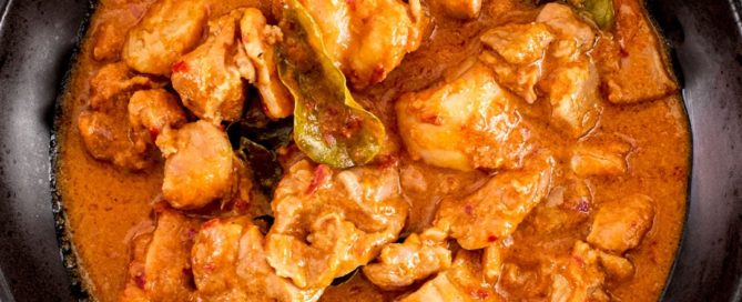 Spicy Malaysian chicken in red sauce with coconut and aromatics