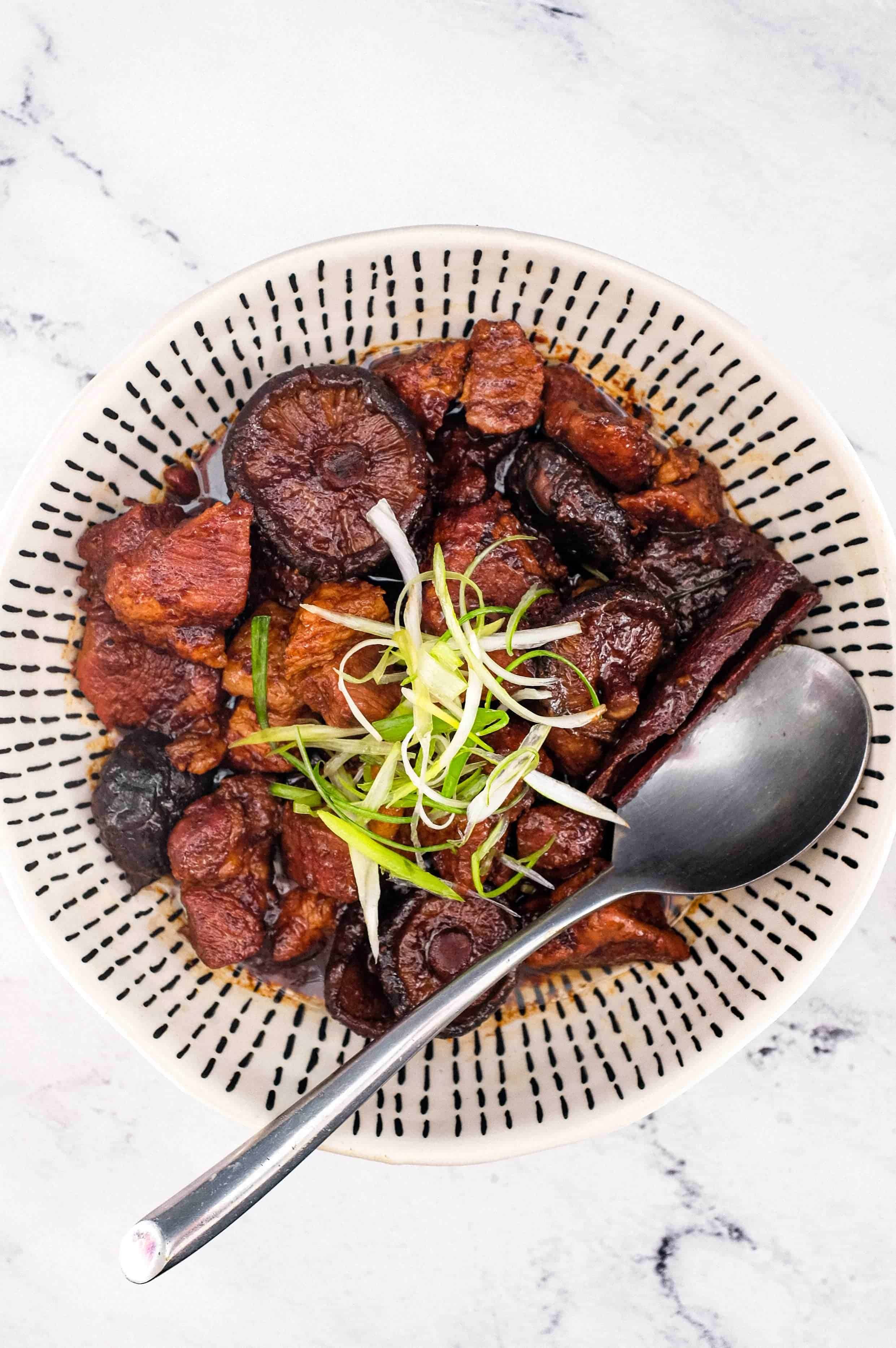 Babi Pingteh (Malaysian Pork Stew) in a bowl with a spoon