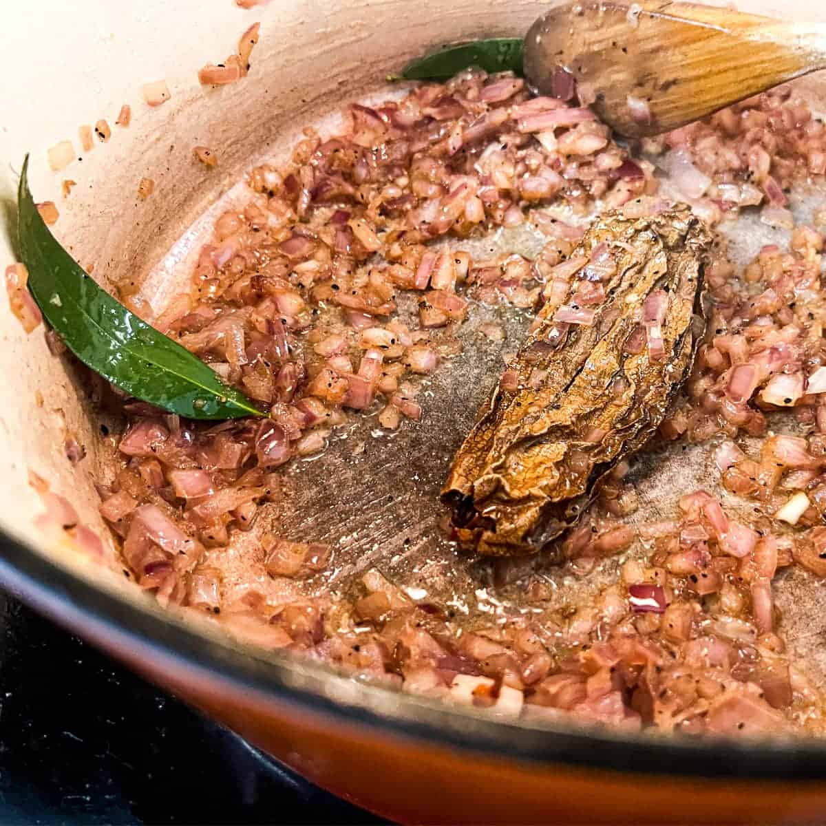 Frying the onion and chipotle pepper for Mexican chicken soup