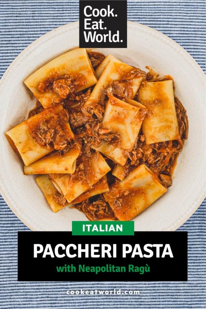 A bowl of paccheri pasta with a rich Neapolitan ragù sauce