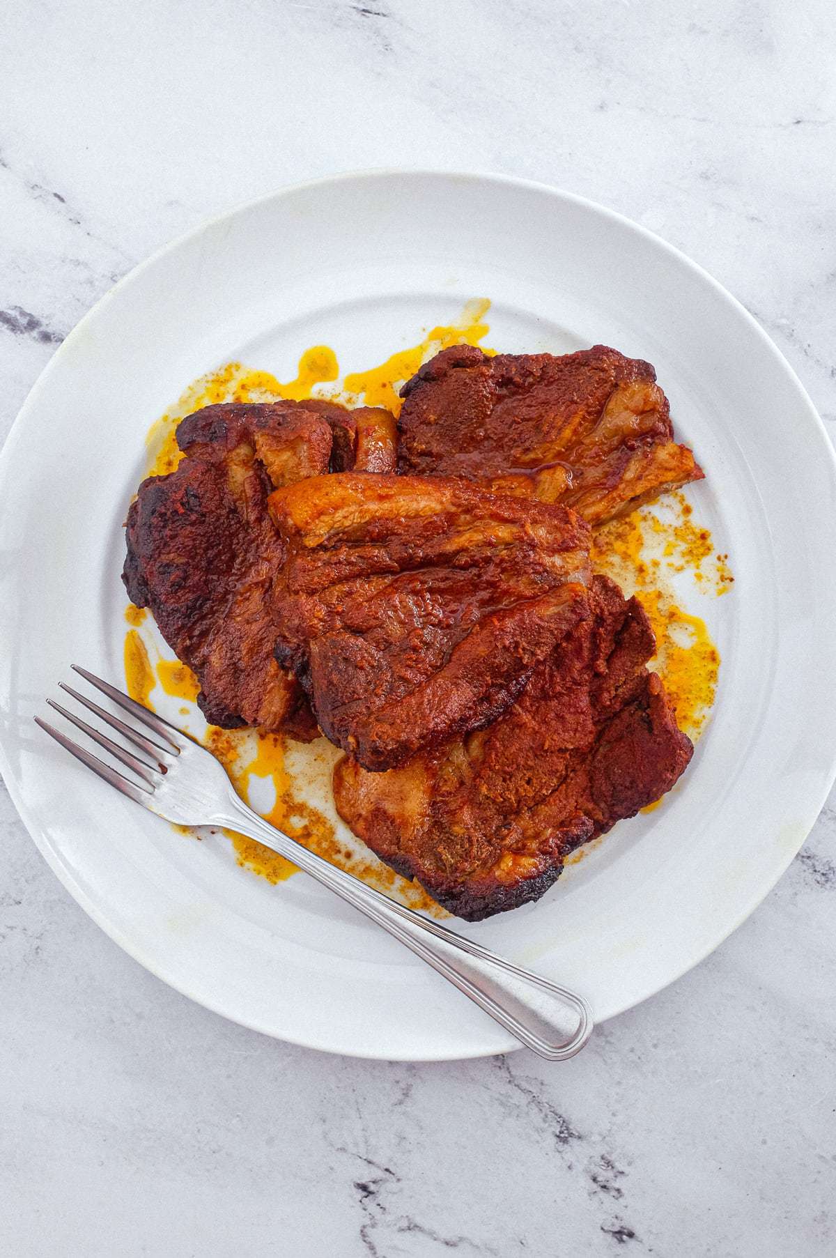 Italian pork (Pampanella Molisana) on platter with a fork