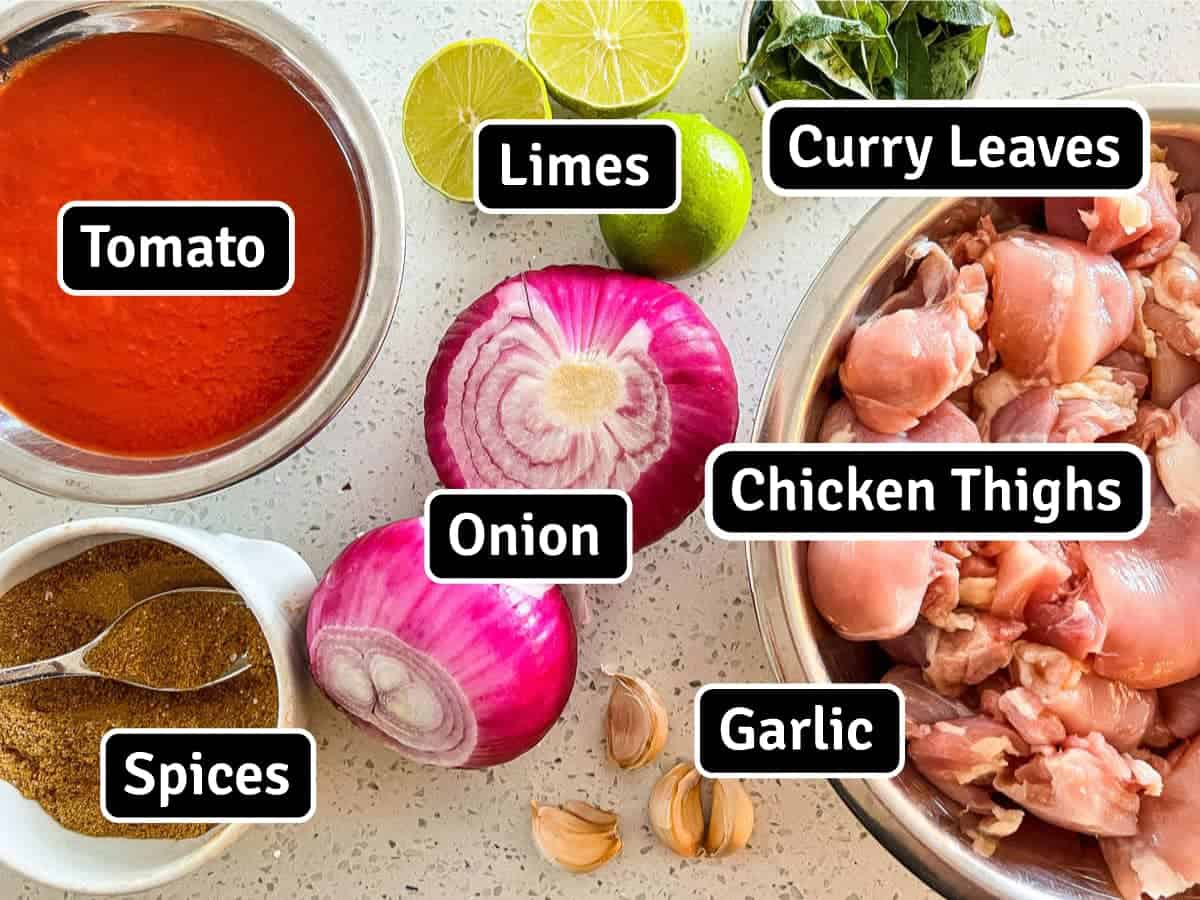 Ingredients for Chicken Pathia Curry - Tomato, Limes, Curry Leaves, Red Onion, Chicken, Garlic and a spice mix.