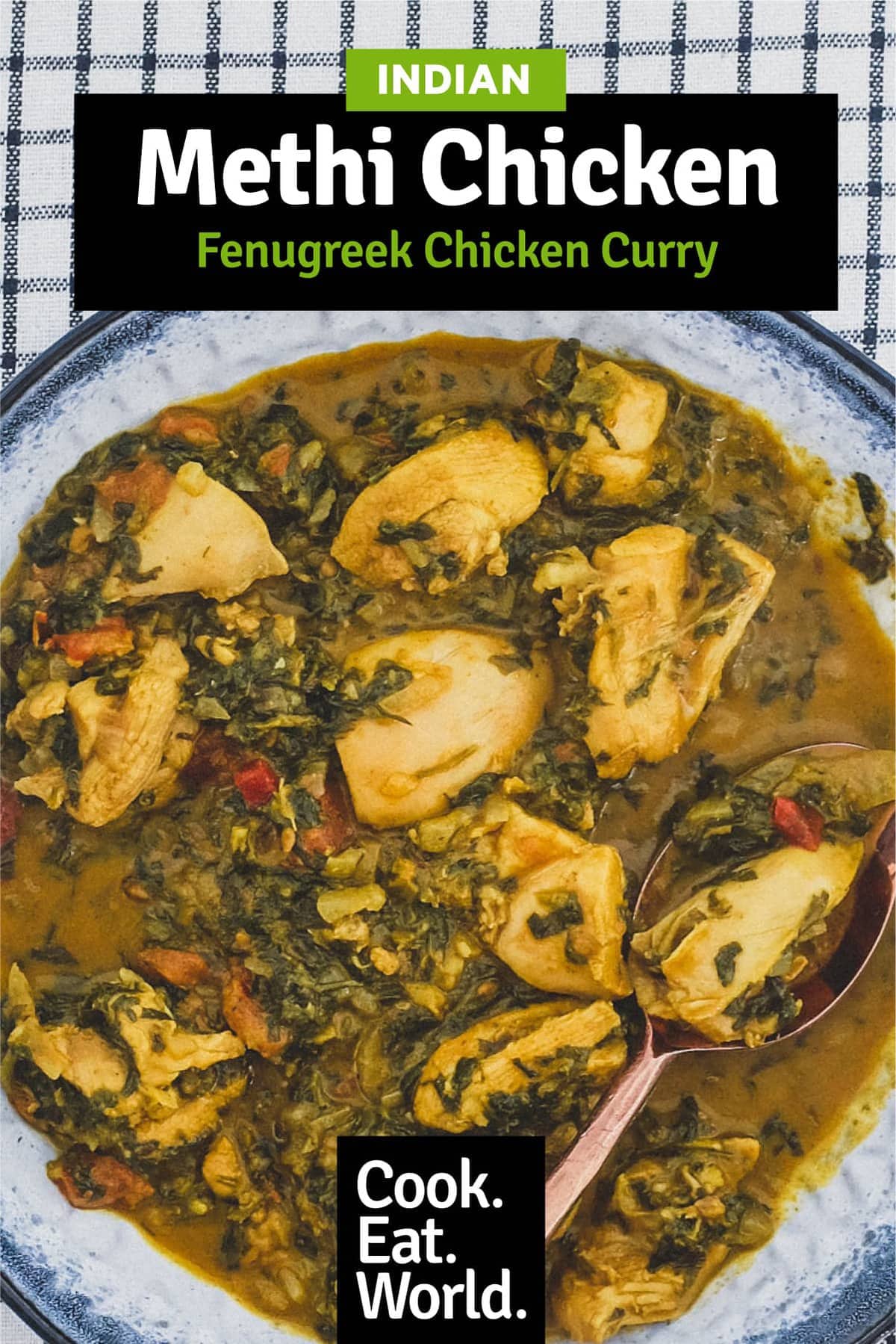 A bowl of chicken curry cooked with fenugreek leaves with a serving spoon