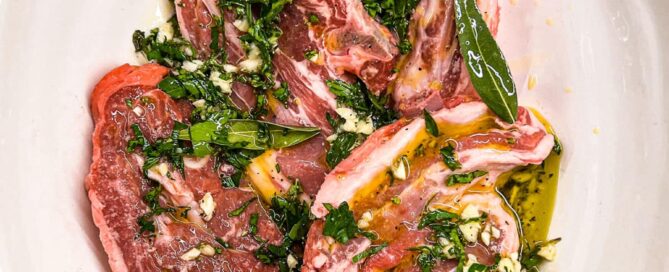 A combination of oil, lemon, garlic and fresh herbs create a simple marinade for Greek style lamb.