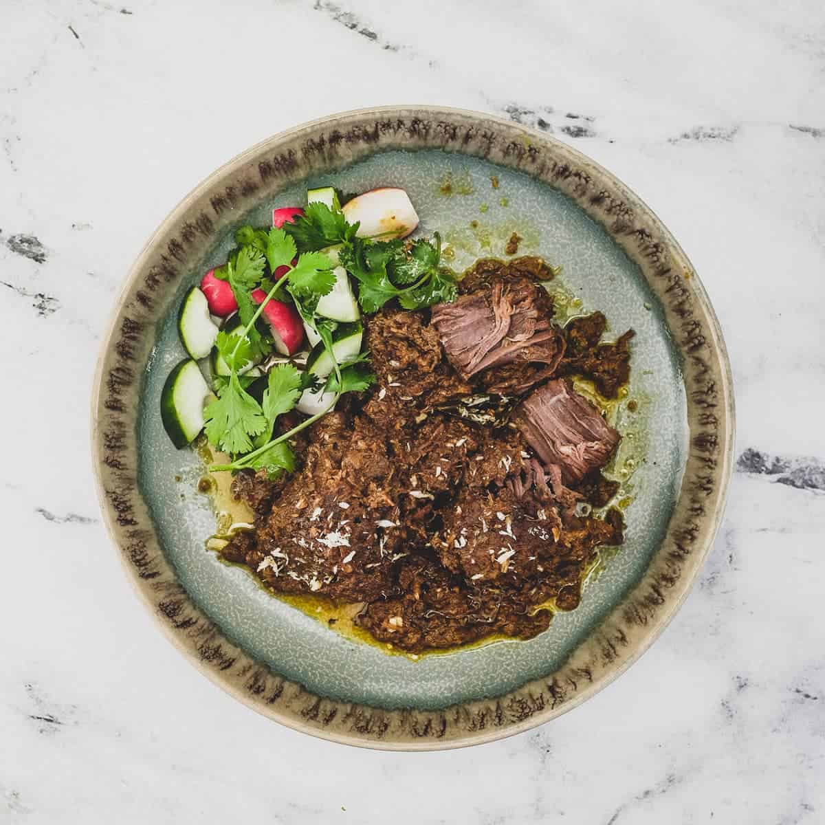 Beef Rendang with salad vegetables