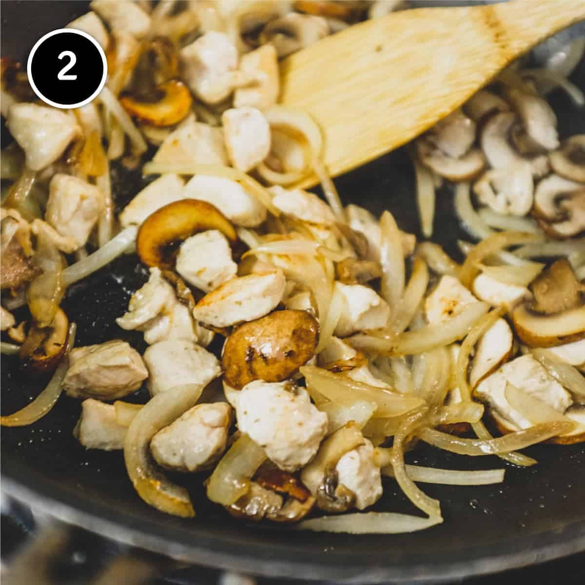 Frying onion, chicken and mushroom for chicken egg foo young patties