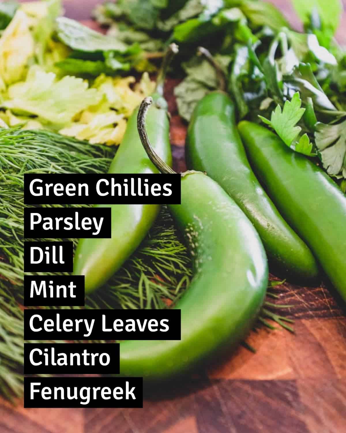 Ingredients for Georgian Green Ajika including chillies and herbs.