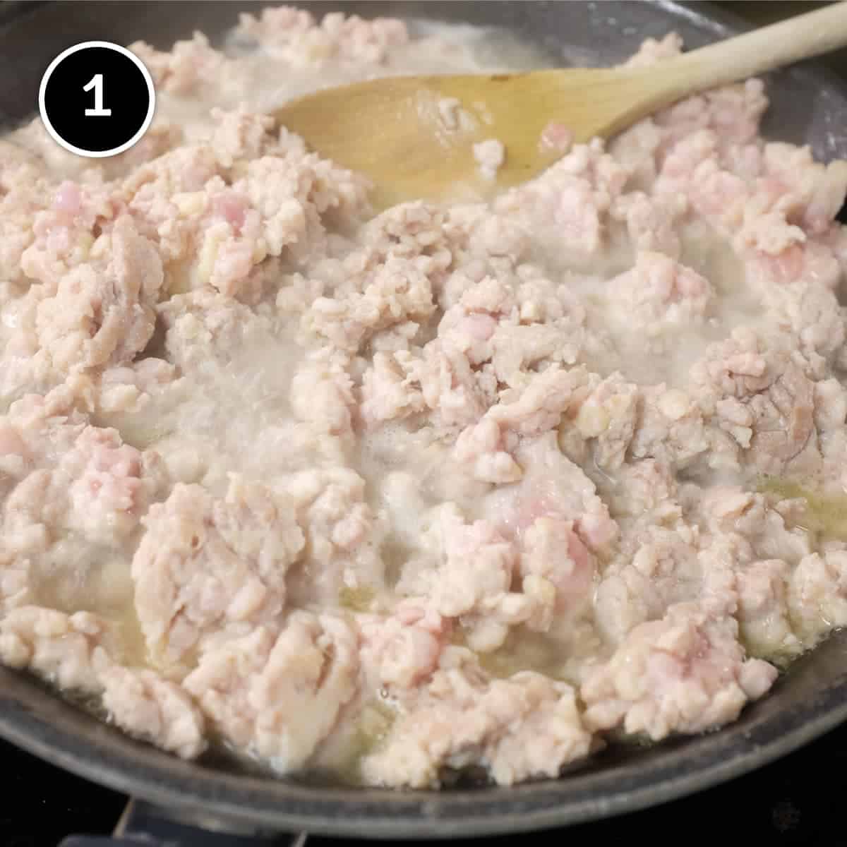 Ground chicken being poached for Laotian chicken larb