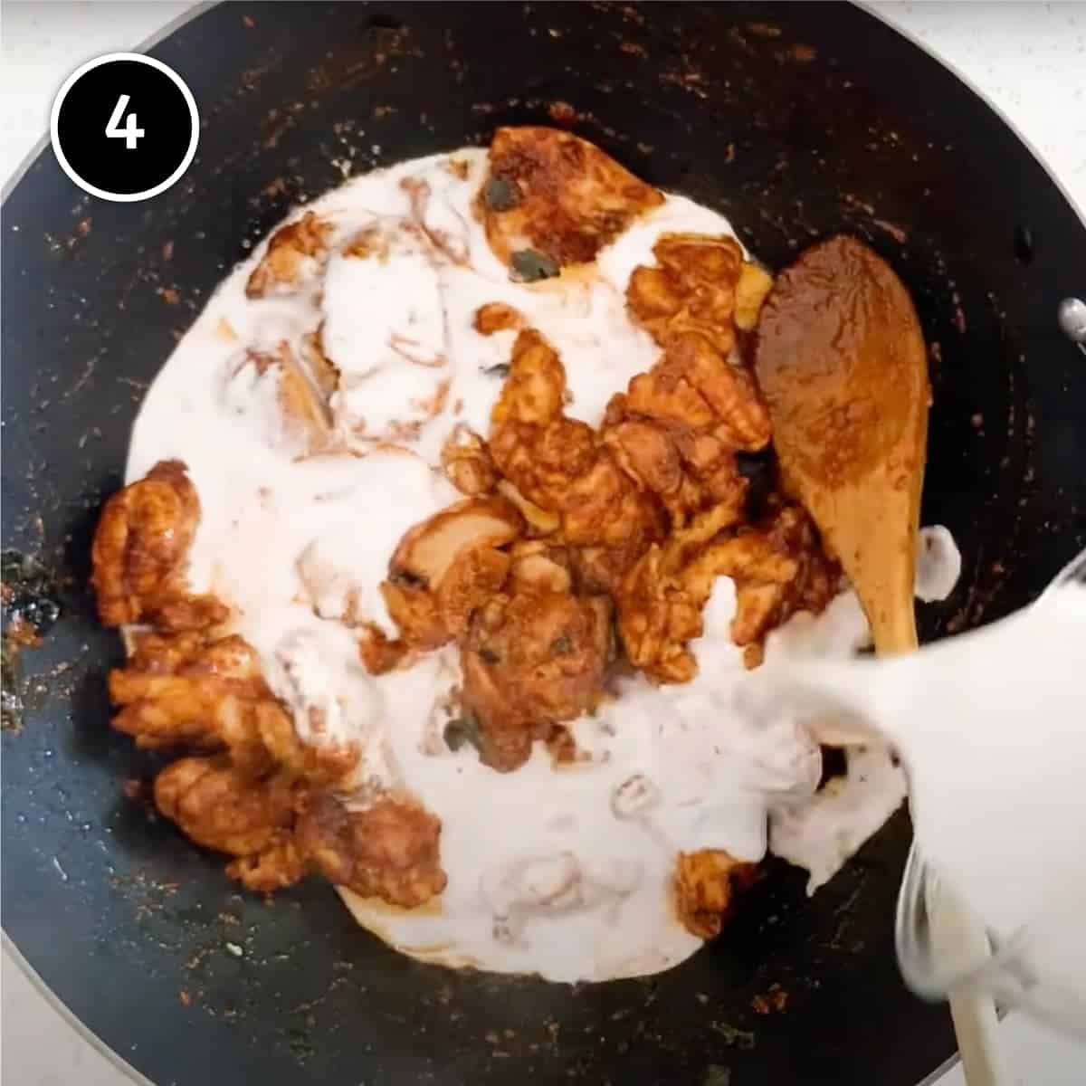 Adding coconut milk to the Malaysian Chicken Curry (Kari Ayam)