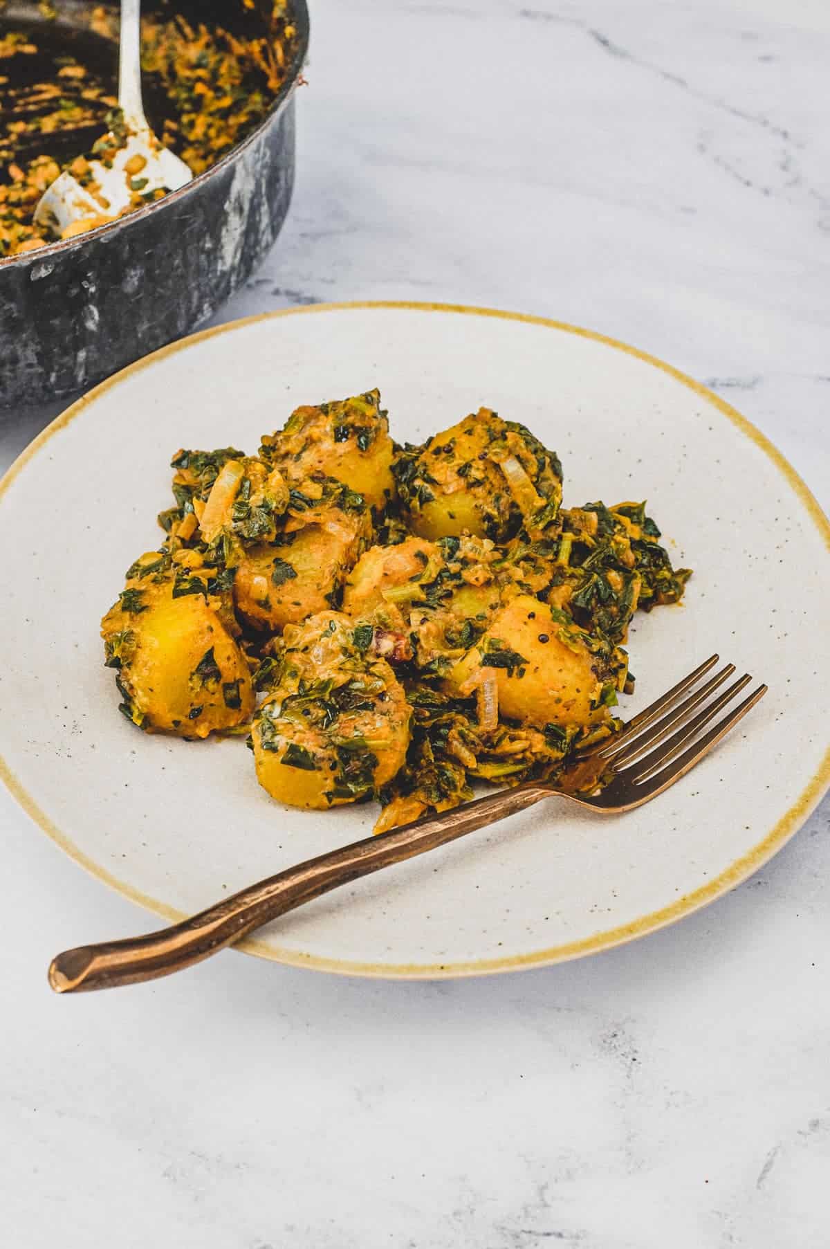 Spinach and Potato cooked in Indian Spices.