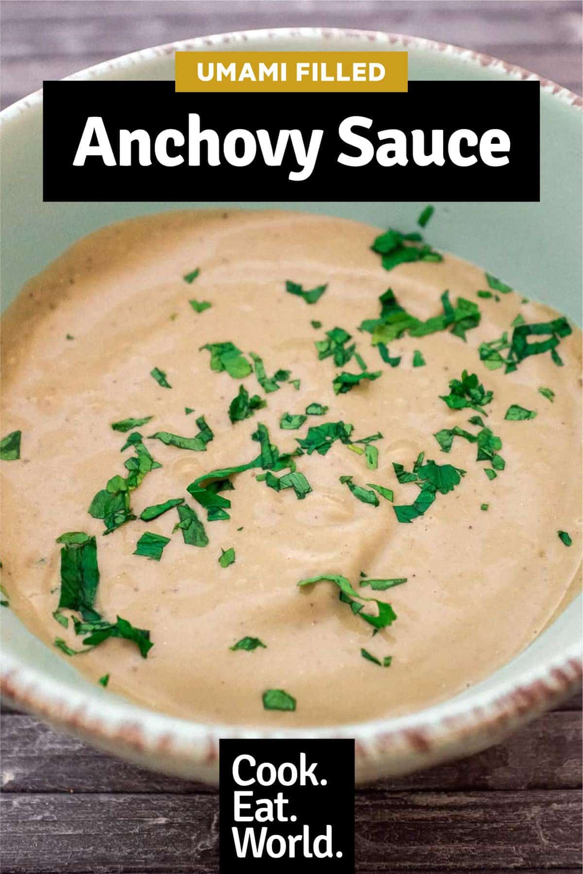 A bowl of Anchovy Sauce, scattered with fresh parsley.