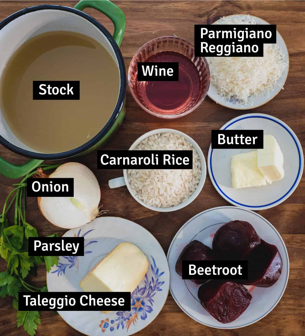 The ingredients for a beetroot risotto with Taleggio cheese - Stock, wine, parmesan, onion, parsley, Taleggio cheese, carnaroli rice, butter and beetroot.