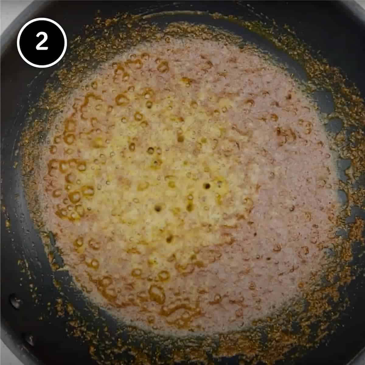 A spice paste being fried in mustard oil for a fish curry | cookeatworld.com