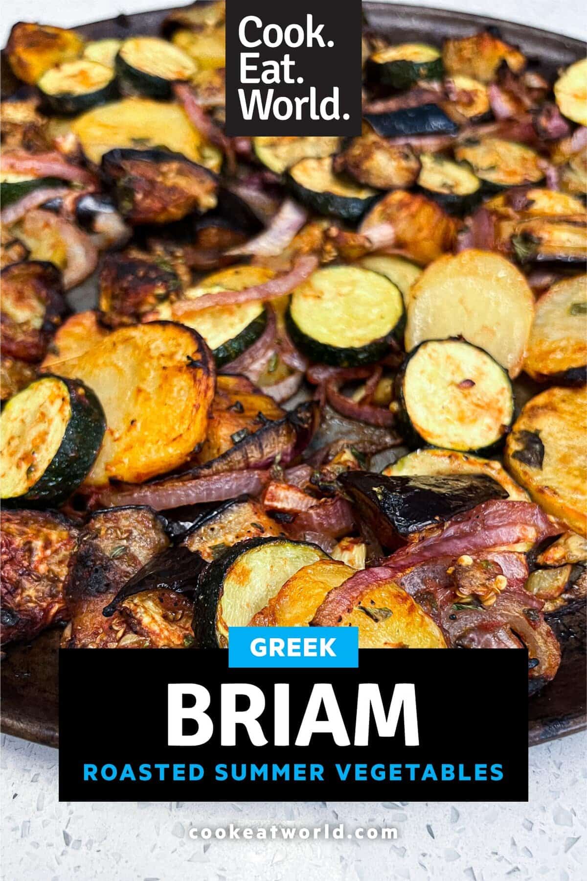 A platter of Greek Roasted Vegetables called Briam scattered with feta cheese and lemon slices