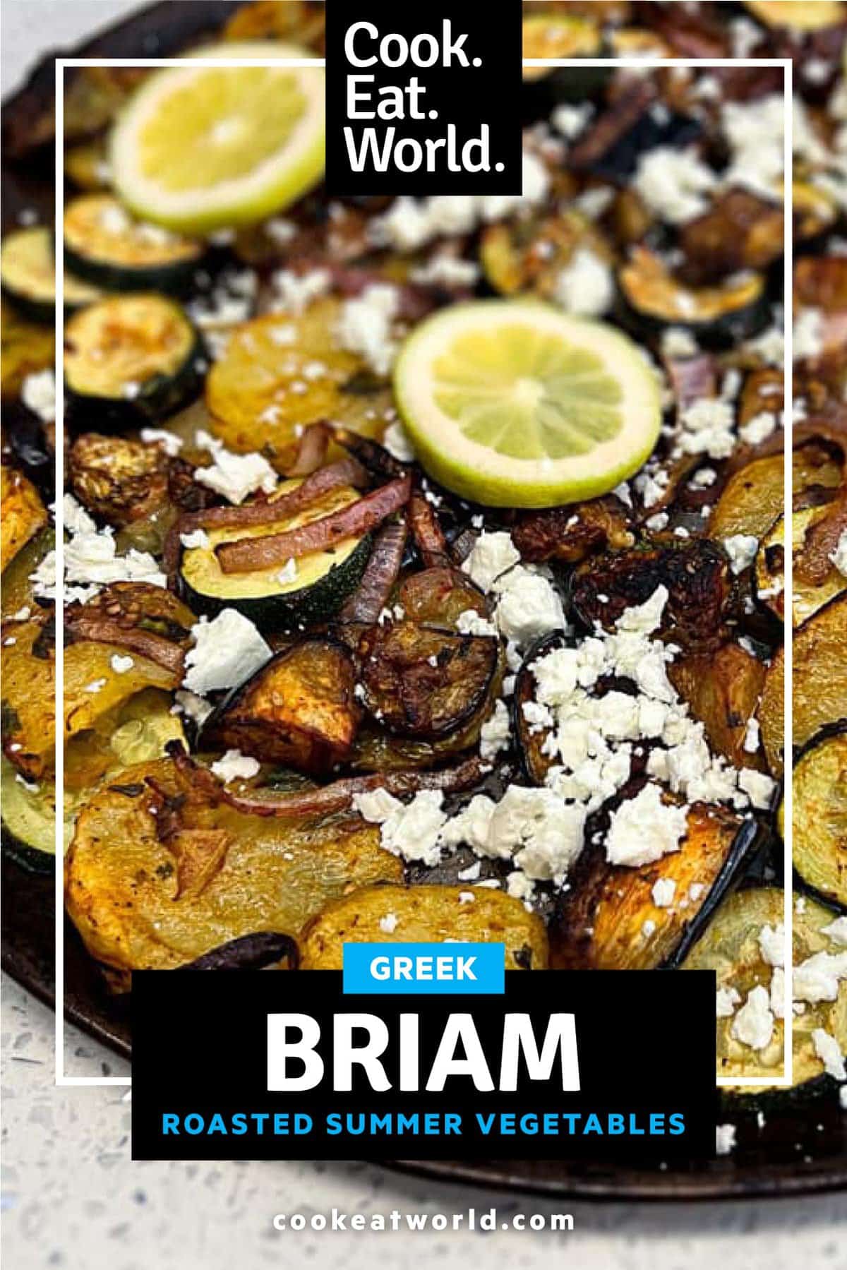 A platter of Greek Roasted Vegetables called Briam scattered with feta cheese and lemon slices