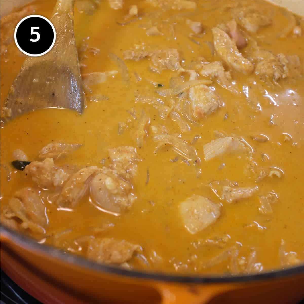 Keralan Chicken Curry (Nadan Khozi) simmering in a pan