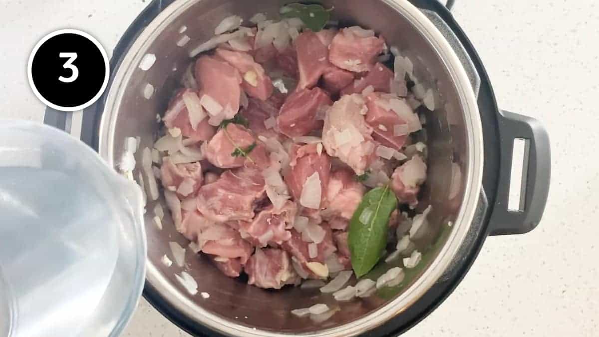 Stirring the water into the Mexican Pozole Blanco soup