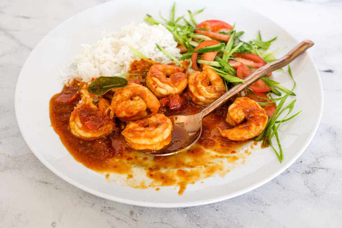 A plate of Sambal Udang (Sambal Prawns) with rice and a salad