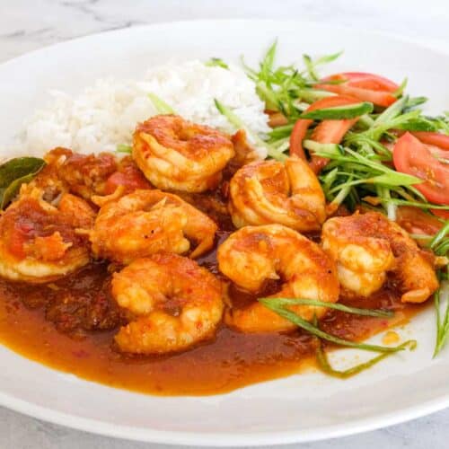 A plate of Sambal Udang (Sambal Prawns) with rice and a salad