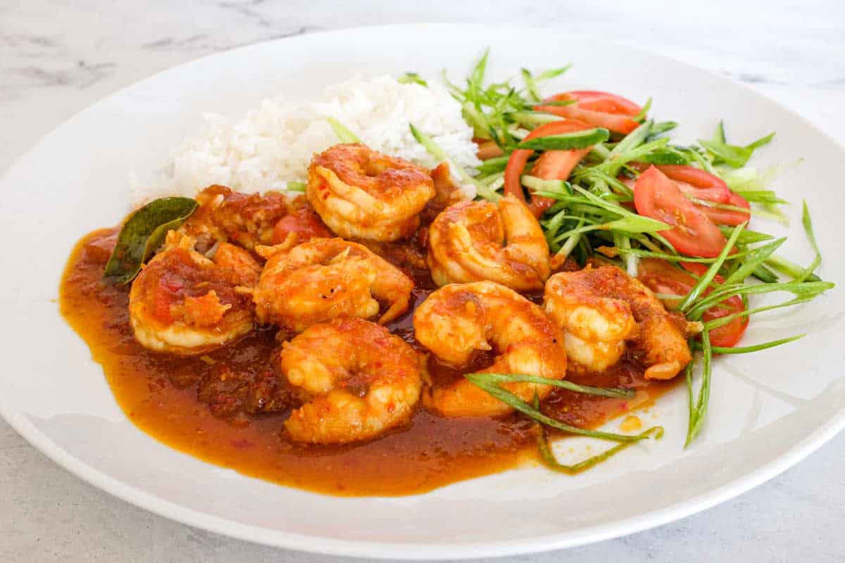 A plate of Sambal Udang (Sambal Prawns) with rice and a salad