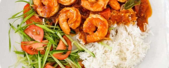 A plate of Sambal Udang (Sambal Prawns) with rice and a salad