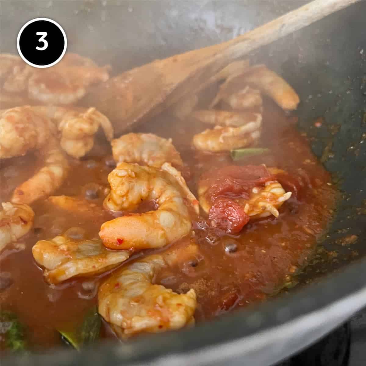 Sambal Udang (sambal prawns) simmering in a pan