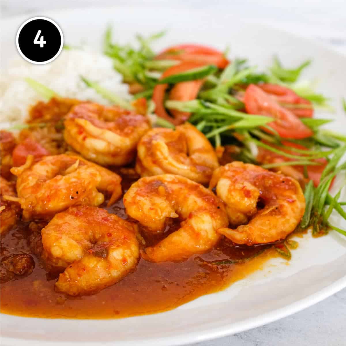 A plate of Sambal Udang (Sambal Prawns) with rice and a salad