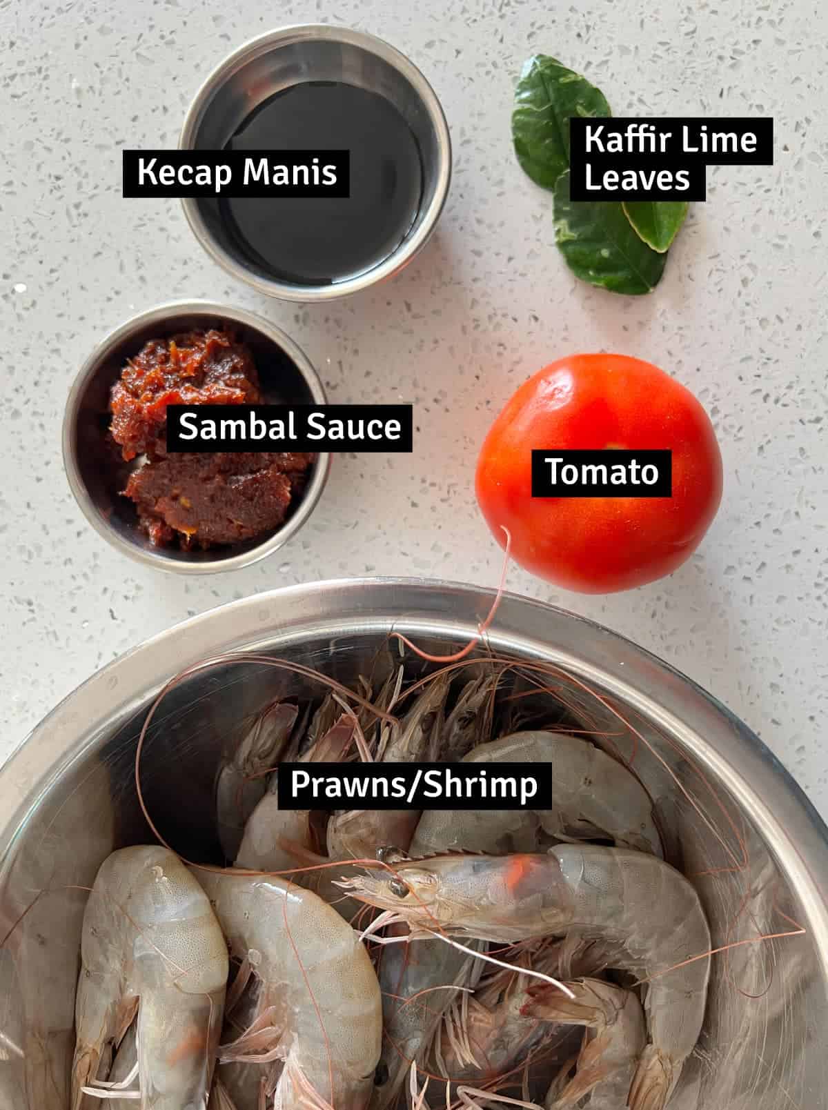 The Ingredients for Sambal Udang: Sambal Sauce, Prawns, tomato, lime leaves and keycap manis.