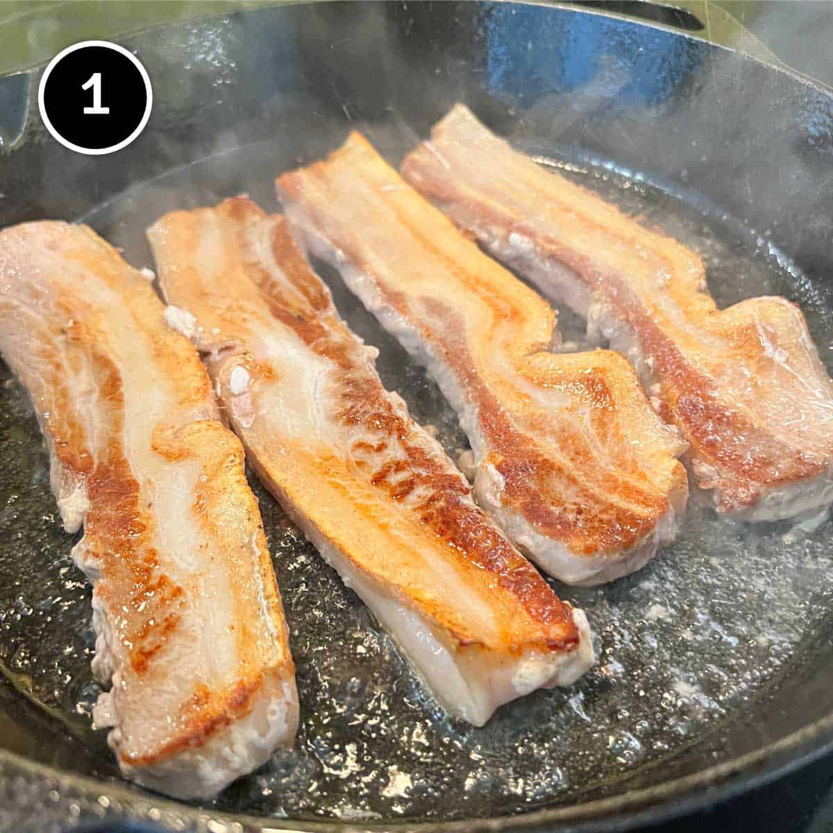 Frying pork belly until browned for Chashu Don (Japanese Pork Rice Bowl)