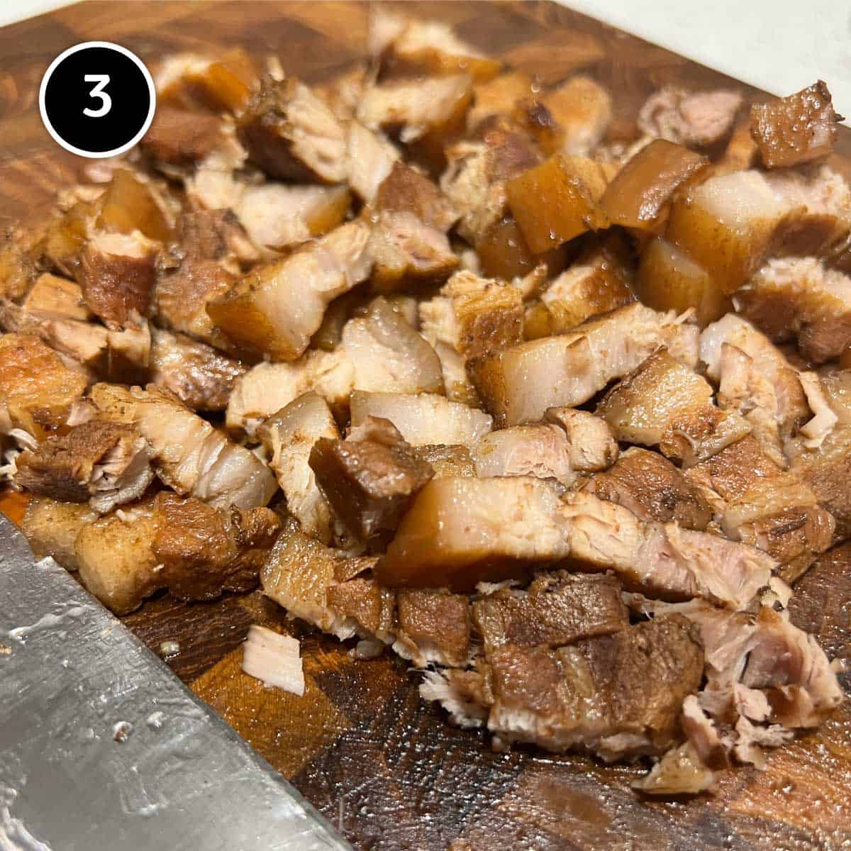 Chopping up the braised pork belly for Chashu Don (Japanese Pork Rice Bowl)