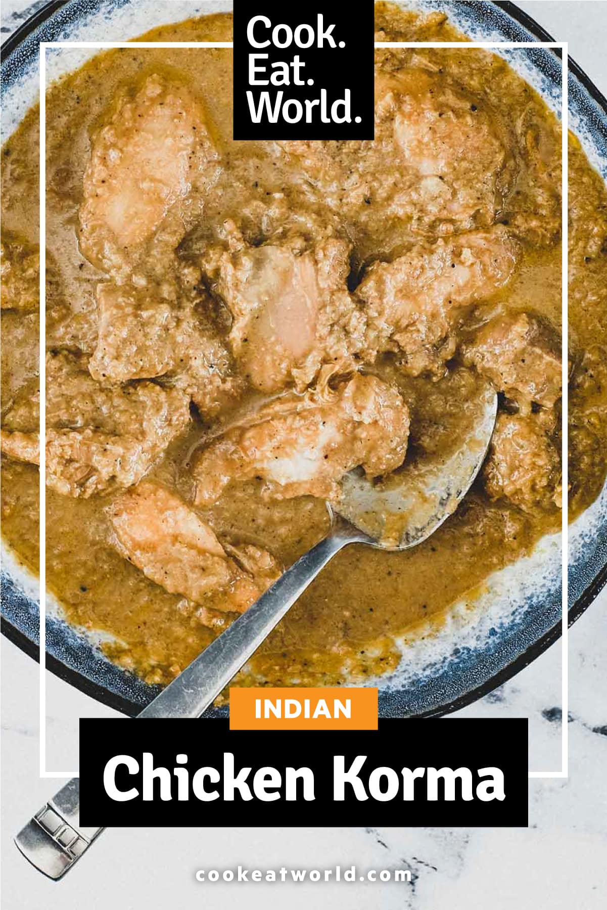 A bowl of Chicken Korma Curry with a spoon