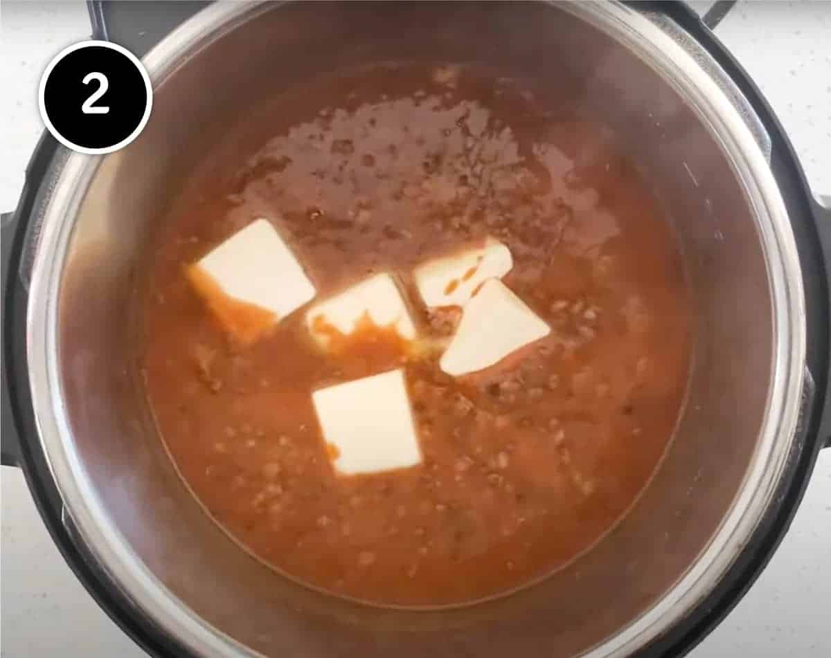 Instant Pot Dal Makhani | cookeatworld.com Adding butter to the Instant Pot Dal Makhani