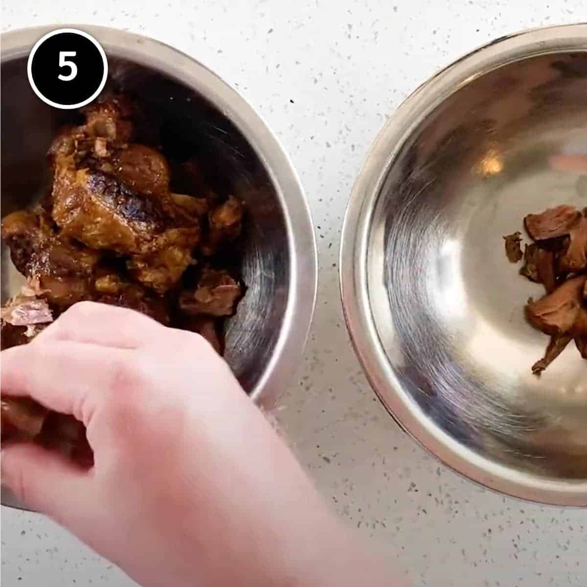 Picking the meat off the oxtails for Chinese Oxtail Soup