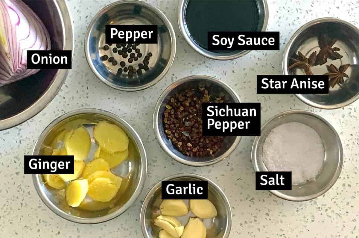 The ingredients for Chinese Oxtail Soup: ginger, garlic, pepper, soy sauce, salt & pepper, star anise and Sichuan peppercorns.